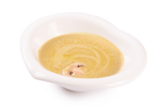 The mushroom cream soup with champignon close-up