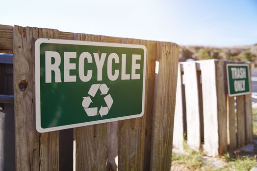 Recycling and waste information sign at the public beach