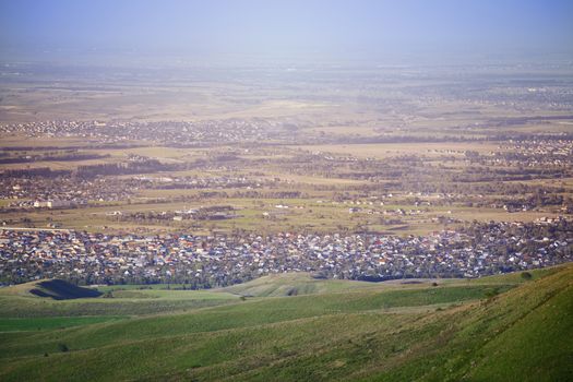 High angle view onto the green fields and villages