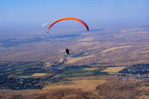 photo of a flight paragliders in summer in Kazakhstan