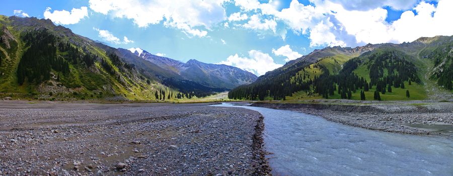 river originating in mountain glaciers and flowing into a Big Almaty lake in the mountains of Kazakhstan, summer