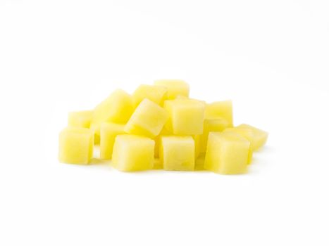 Heap of diced raw potatoes isolated on white background. Pile uncooked potatoes cube. Isolated on white with clipping path.