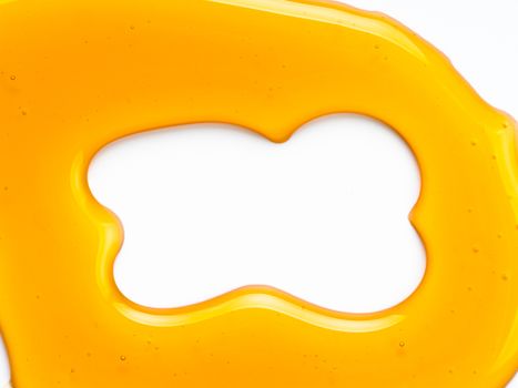 Abstract pattern from honey. Can use for design. Copy space for text. Honey background isolated on white with clipping path.