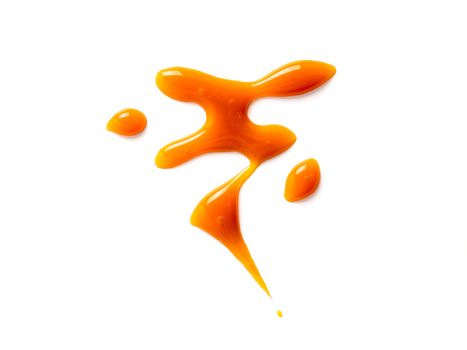 sweet caramel sauce isolated on white background Top view or flat lay. Caramel isolated on white with clipping path.