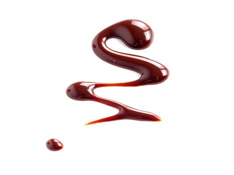 Chocolate sauce on white. Abstract lines made of chocolate or soy sauce isolated on white background