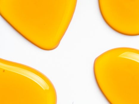 Honey drops. Abstract pattern from honey drops. Isolated on white with clipping path. Can use for design. Copy space for text.