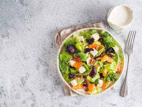 Beetroot, Feta Cheese and Orange Salad. Close up. Top view or flat-lay. Copy space for text. Gray concrete background