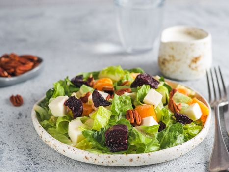 Beetroot, Feta Cheese and Orange Salad. Close up. Copy space for text. Gray concrete background