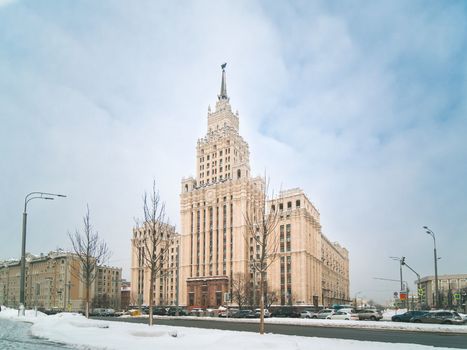 Winter view of neo-classical Stalin-era high-rise building on Red Gate Square, Garden Ring road in Moscow. Russia. Copy space