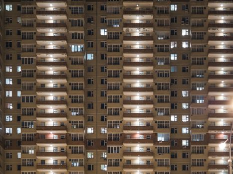 Night view of exterior apartment building. High rise apartments in night light