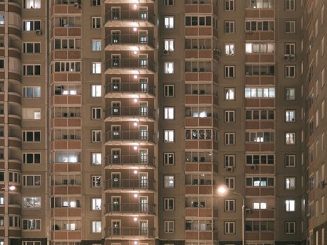 Night view of exterior apartment building. High rise apartments in night light