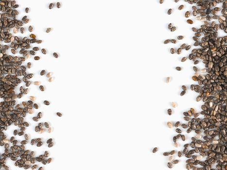 Chia seeds with copy space. Isolated on white. Top view or flat lay. Healthy food and diet concept