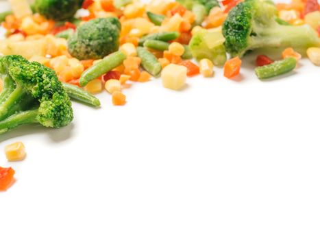 Frozen vegetables assorted isolated on white with clipping path. Frosen vegetables with ice Isolated one edge. Frozen mix vegetables with copy space for text.