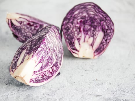 red cabbage on gray cement background. Front side view of red cabbage on gray table with copy space for text. Background for healthy eat, vegetarian meny