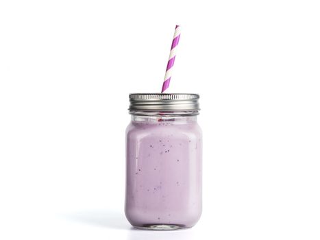 Blueberry smoothie in mason jar glass. Isolated on white with clipping path.