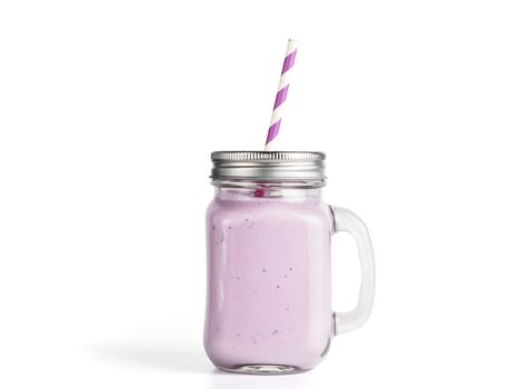 Blueberry smoothie in mason jar glass. Isolated on white with clipping path.