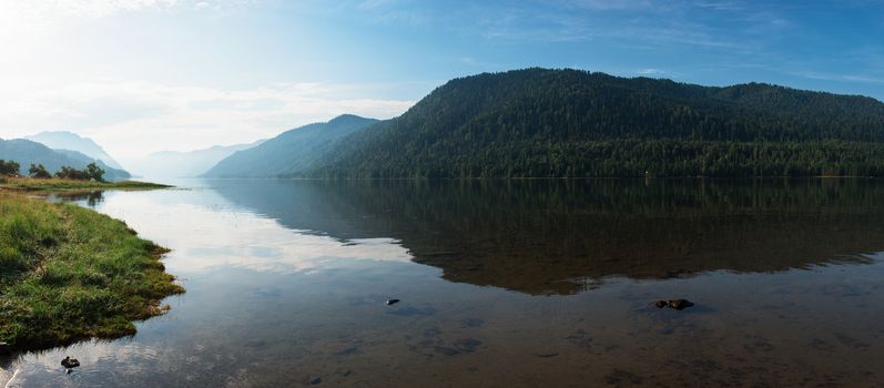 Teletskoye lake in Altai mountains, Siberia, Russia. Beauty panoramic picture in summer morning.