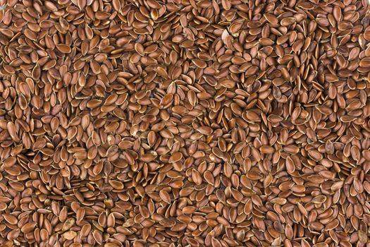 Flax seeds background, linseed texture close-up, top view