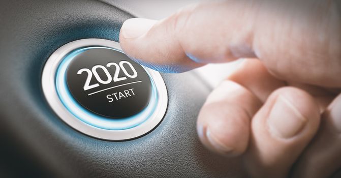 Finger about to press a car ignition button with the text 2020 start. Year two thousand and twenty concept.