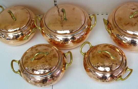 pots made of copper. polished in various sizes