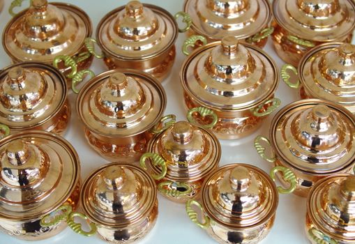 pots made of copper. polished in various sizes