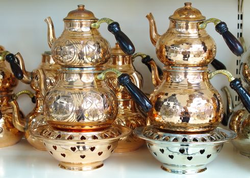 copper teapot set and samovar. under barbecue