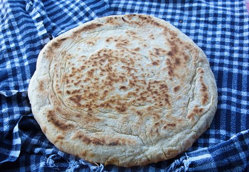 "Bazlama" It is a kind of bread from Turkish cuisine. flat, round and fermented bread.