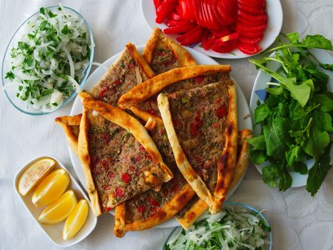 Pita(pide) with minced meat and cheese. pita(pide) from traditional Turkish cuisine