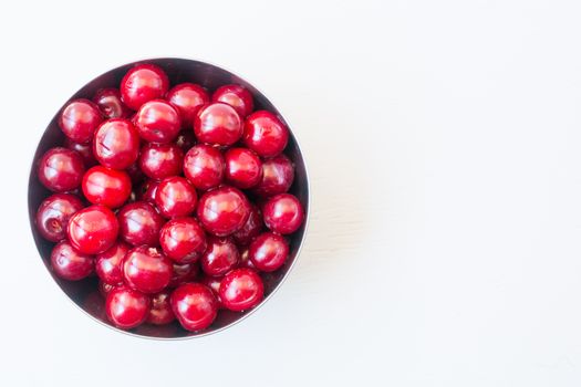 sour cherry fruit frame. Organic sour cherry background. isolated white background. Top view. Free space for your text