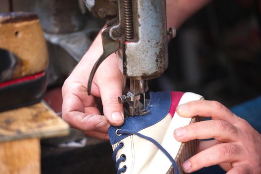 Cobbler. The master worker who repairs the shoe