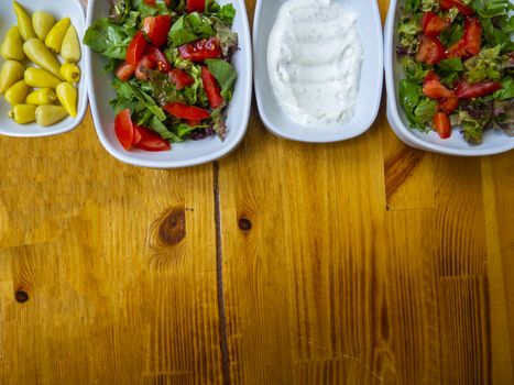 appetizer table. background consisting of salads and appetizer. Organic food background. isolated wooden background. Top view. Free space for your text