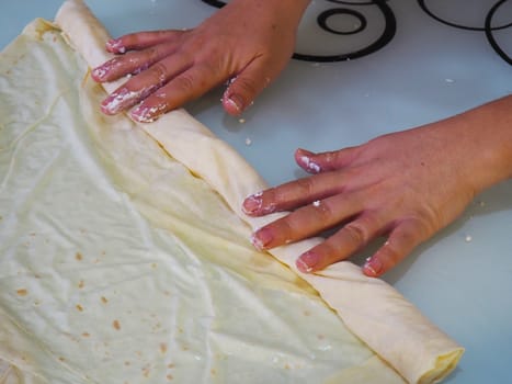 she prepares a woman cheese patty.