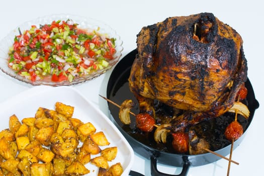 chicken and potatoes fried in the oven. Mixed salad. with cooked tomatoes and onions