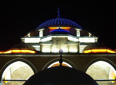 illuminated mosque at night. illuminated dome at night in the dark