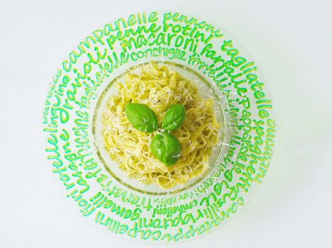 Fettuccine pasta. basil, pistachio, parmesan cheese, creamy pasta. It is a popular pasta type in the Roman and Tuscan cuisine.