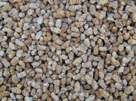 dried white mulberry fruit. Top view organic dried fruit background