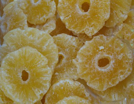 dried pineapple tropical fruit. Top view organic dried fruit background