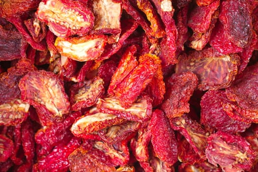 dried tomatoes. After slicing the tomatoes, they are salted and tied on the rope and dried in the sun.