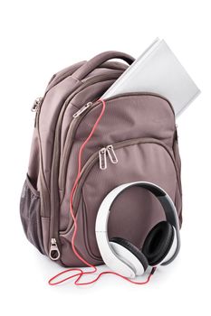 Backpack with headphones and notebook, isolated on white background.