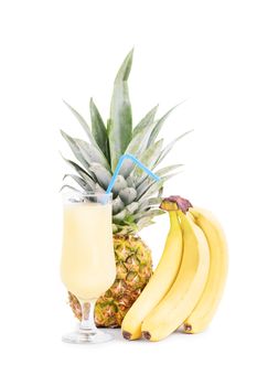 Bananas, pineapple and a smoothie glass, isolated on white background.