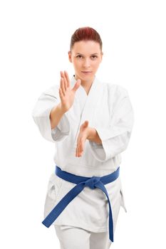 A portrait of a beautiful young girl in a kimono, standing in a combat stance, isolated on white background.