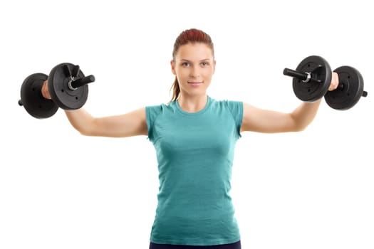 A portrait of a beautiful girl working out with a set of dumbbells, isolated on a white background.
