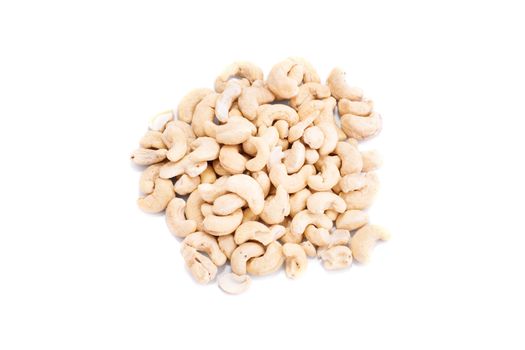 Top perspective of a heap of cashews, isolated on white background.