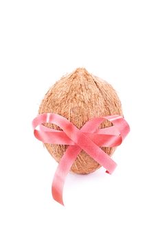 Coconut wrapped with red ribbon, isolated on white background.