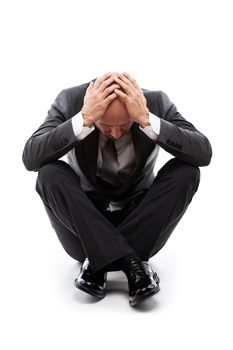 Business problems and failure at work concept - unhappy crying tired or stressed businessman sitting in depression hand hiding face white isolated