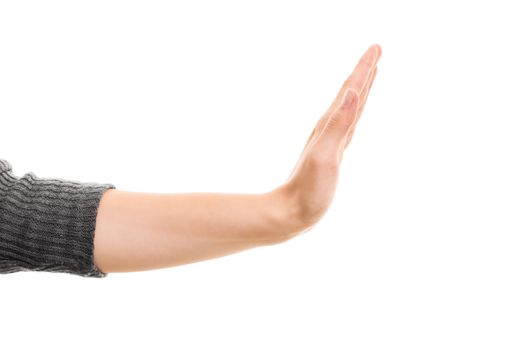 A close up shot of a hand gesturing stop, isolated on white background.