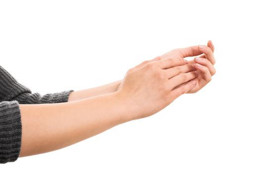 A close up shot of female hands clapping, isolated on white background.