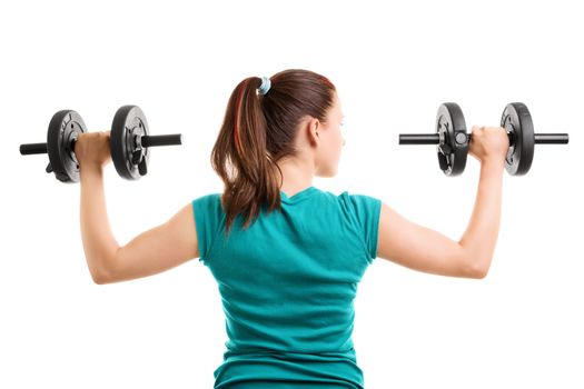 Fit young woman doing shoulder raises with dumbbells, isolated on white background.