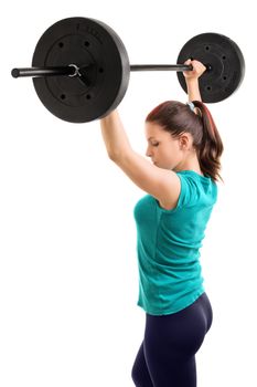 And hold! Young girl athlete holding a barbell up, isolated on white background.