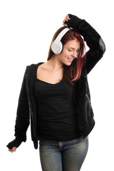 I'm dancing to my favorite song, mhm. Casually dressed young girl with headphones, dancing and listening to music, isolated on white background.